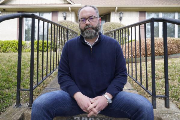 Attorney Mark Melton poses for a photo in front of his home in Dallas, Friday, April 2, 2021. Melton has formed a group made up of volunteer attorneys to help people avoid evictions if they can't pay rent due to the pandemic. (AP Photo/LM Otero)