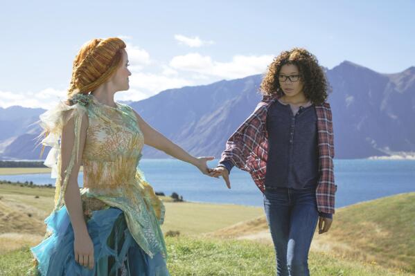 This image released by Disney shows Reese Witherspoon, left, and Storm Reid in a scene from the film "A Wrinkle In Time." The classic sci-fi coming-of-age tale, has been adapted into a film, a TV movie, opera, several plays and a graphic novel. Now a stage musical is planned with music and lyrics by composer Heather Christian, a story by Lauren Yee and direction by Lee Sunday Evans. Dates for future productions, as well as additional creative team members and cast, will be announced in 2023. (Atsushi Nishijima/Disney via AP)