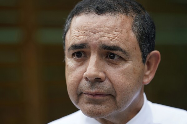 FILE - U.S. Rep. Henry Cuellar, D-Texas, talks to a member of the media during a campaign event in San Antonio, May 4, 2022. Cuellar was carjacked late Monday, Oct. 2, 2023, in Washington's Navy Yard area, about a mile from the U.S. Capitol, multiple media sources reported. (AP Photo/Eric Gay, File)