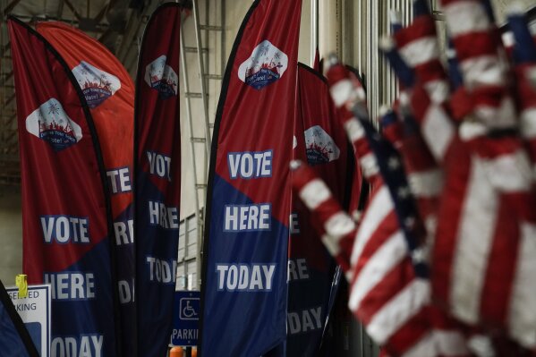 Vote signs and American flags used on Election Day are stored at the Clark County Election Department in North Las Vegas, Friday, Nov. 6, 2020. (AP Photo/Jae C. Hong)