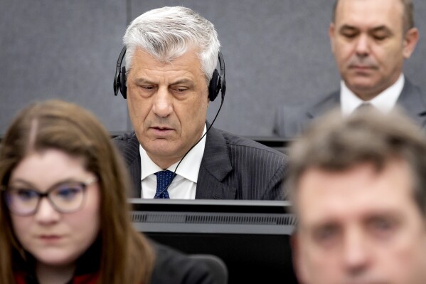 FILE - Former Kosovo president Hashim Thaci, left, appears before the Kosovo Tribunal as he defends himself in the Hague, on April 3, 2023. International judges on Monday Dec. 4, 2023 rejected a demand by prosecutors for a nearly complete ban on prison visits for three former Kosovo Liberation Army leaders on trial at The Hague for war crimes. Kosovo ex-President Hashim Thaci, former parliamentary Speaker Kadri Veseli and ex-lawmaker Rexhep Selimi face charges including murder, torture and persecution during and after the 1998-1999 war with Serbia. (Koen van Weel/Pool via AP, File)