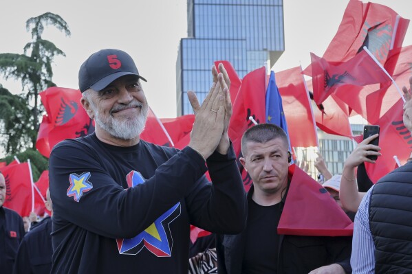 Albanian Prime Minister Edi Rama applauds to his supporters during a celebratory rally for his Socialist Party victory in the last parliamentary elections, in Tirana, Albania, Wednesday, May 14, 2025. (AP Photo/Vlasov Sulaj)