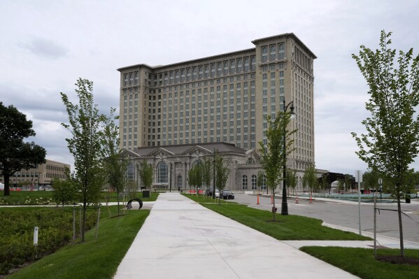 FILE- The exterior of the Michigan Central Station is seen, July 13, 2023 in Detroit. A once hulking scavenger-ravaged monolith that symbolized Detroit's decline reopens this week after a massive six-year multimillion dollar renovation by Ford Motor Co., which restored the Michigan Central Station to its past grandeur with a focus squarely on the future of mobility. (AP Photo/Carlos Osorio_File)