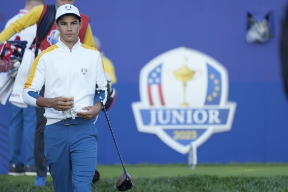 Europe's Lev Grinberg, of Ukraine, walks off the 1st tee as he takes part in the Junior Ryder Cup golf tournament at the Marco Simone Golf Club in Guidonia Montecelio, Italy, Thursday, Sept. 28, 2023. The Ryder Cup starts Sept. 29, at the Marco Simone Golf Club. (AP Photo/Andrew Medichini)