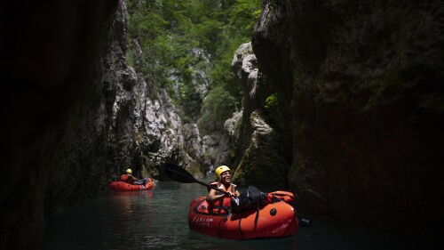 Tourists practice packrafting along the Verdon Gorge in southern France, Monday, June 19, 2023. Human-caused climate change is lengthening droughts in southern France, meaning the reservoirs are increasingly drained to lower levels to maintain the power generation and water supply needed for nearby towns and cities. It's concerning those in the tourism industry, who are working out how to keep their lakeside businesses afloat. (AP Photo/Daniel Cole)