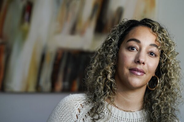 Dani Ayers CEO of the #MeToo movement poses for a portrait in her home in Atlanta on Tuesday, Oct. 13, 2020. Ayers quietly yet with a bold vision transitioned into becoming the movement’s CEO in July after first joining the organization in 2018. (AP Photo/John Bazemore)