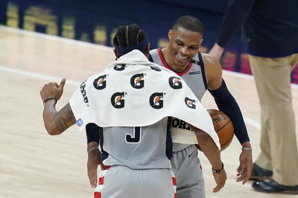 Washington Wizards' Russell Westbrook, right, celebrates with Bradley Beal following an NBA basketball game against the Indiana Pacers, Saturday, May 8, 2021, in Indianapolis. Washington won 133-132 in overtime. (AP Photo/Darron Cummings)