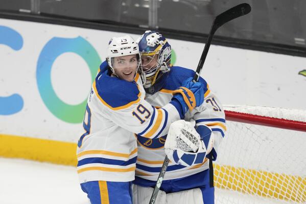 Buffalo Sabres center Peyton Krebs (19) and goaltender Eric Comrie (31) celebrate after a 7-3 over the Anaheim Ducks in an NHL hockey game in Anaheim, Calif., Wednesday, Feb. 15, 2023. (AP Photo/Ashley Landis)