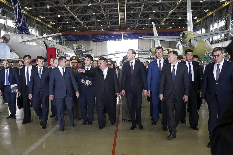In this photo released by the governor of the Russian far eastern region of Khabarovsky Krai region Mikhail Degtyarev telegram channel, North Korean leader Kim Jong Un, center, and Deputy Prime Minister and Minister of Trade and Industry Denis Manturov, center right, visit a Russian aircraft plant that builds fighter jets in Komsomolsk-on-Amur, about 6,200 kilometers (3,900 miles) east of Moscow, Russia Friday, Sept. 15, 2023. (The governor of the Russian far eastern region of Khabarovsky Krai region Mikhail Degtyarev telegram channel via AP)