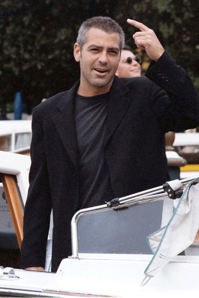  Clooney arrives at the Lido for to promote "Out Of Sight." (AP Photo/Francesco Proietti)
