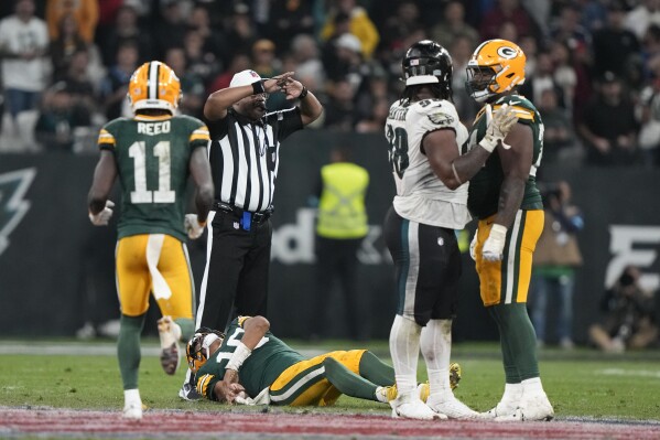 Jordan Love injury: Packers QB helped off the field in Brazil | AP News