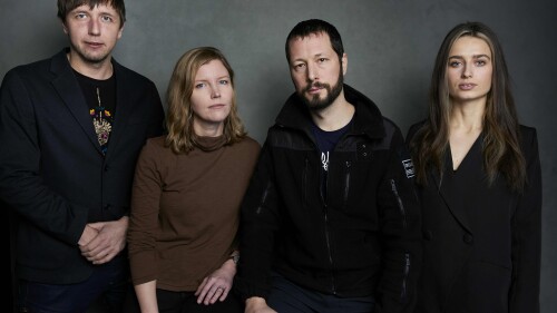 FILE - Photographer Evgeniy Maloletka, from left, "Frontline" producer/editor Michelle Mizner, director Mstyslav Chernov, and field producer Vasilisa Stepanenko pose for a portrait to promote the film "20 Days in Mariupol" at the Latinx House during the Sundance Film Festival on Sunday, Jan. 22, 2023, in Park City, Utah. The film, a joint project between The Associated Press and PBS "Frontline," is coming to a handful of theaters around the U.S. in July, starting with New York and Chicago this Friday. (Photo by Taylor Jewell/Invision/AP, File)