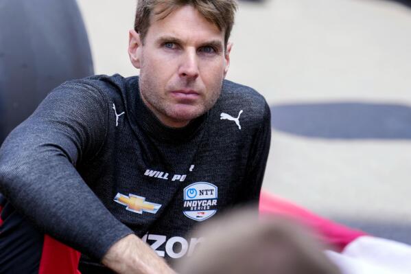 FILE - Will Power, of Australia, sits on the track before the Indianapolis 500 auto race at Indianapolis Motor Speedway in Indianapolis, May 29, 2022. The IndyCar season begins Sunday, March 5, 2023, with the Grand Prix of St. Petersburg. (AP Photo/AJ Mast, File)