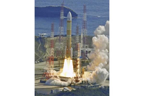 An H3 rocket lifts off from Tanegashima Space Center in Kagoshima, southern Japan on March 7, 2023. Japan's space agency on Tuesday, Feb. 13, 2024, postponed the second test flight of its new flagship rocket H3 series that was planned for this week because of bad weather forecasts at the launch site, as space officials scramble scramble to ensure a successful liftoff a year after a failed debut flight. (Kyodo News via AP)