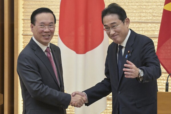 Vietnam's President Vo Van Thuong, left, and Japan's Prime Minister Fumio Kishida, right, shake hands at the end of a joint press conference at the prime minister's official residence in Tokyo, Japan, Monday, Nov. 27, 2023. (Richard A. Brooks/Pool Photo via AP)