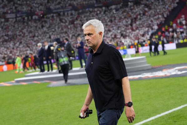 Roma's head coach Jose Mourinho walks away with his second place medal after receiving it at the end of the Europa League final soccer match between Sevilla and Roma, at the Puskas Arena in Budapest, Hungary, Wednesday, May 31, 2023. Sevilla defeated Roma 4-1 in a penalty shootout after the match ended tied 1-1. (AP Photo/Petr David Josek)