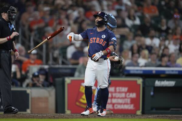Houston Astros' Jose Altuve tosses his bat after striking out during the fifth inning of a baseball game against the Tampa Bay Rays in Houston, Sunday, June 1, 2025. (AP Photo/Ashley Landis)