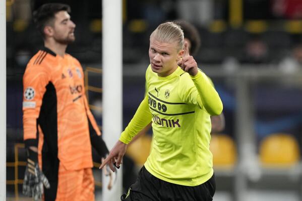 Dortmund's Erling Haaland, celebrates after he scores his second goal and his sides 5th goal of the game during the Champions League group C soccer match between Borussia Dortmund and Besiktas Istanbul in Dortmund, Germany, Tuesday, Dec. 7, 2021. (AP Photo/Martin Meissner)