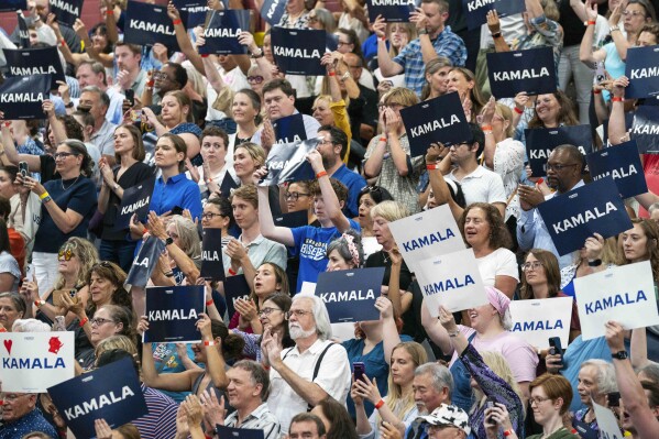 Attendees hold up signs in support of Vice President Kamala Harris, July 23, in West Allis, Wis. (AP Photo/Kayla Wolf)