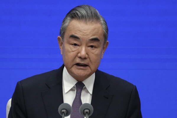 Chinese Foreign Minister Wang Yi speaks during a press conference after the government released a White Paper called 'A Global Community of Shared Future: China's Proposals and Actions' at the State Council Information Office in Beijing, Tuesday, Sept. 26, 2023. Wang laid out a vision for international relations Tuesday that left little doubt that the world's rising power is trying to chart a new course that breaks with Western models. (AP Photo/Andy Wong)