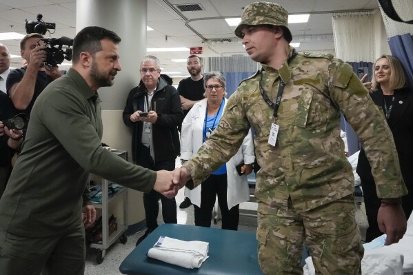 Ukrainian President Volodymyr Zelenskyy visits with wounded Ukrainian soldiers at Staten Island University Hospital, in New York, Monday, Sept. 18, 2023. (AP Photo/Bryan Woolston, Pool)