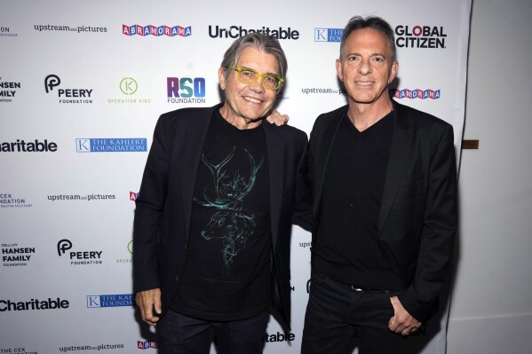 File - Director Stephen Gyllenhaal, left, and Dan Pallotta attend the premiere of "Uncharitable" on Sept. 21, 2023, in New York. The new documentary puts the long-running debate in the nonprofit sector over the role of overhead back in the spotlight. (Photo by Charles Sykes/Invision/AP, File)