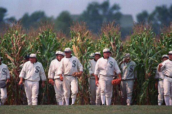 FILE - Persons portraying ghost player characters, similar to those in the film "Field of Dreams," emerge from the cornfield at the "Field of Dreams" movie site in Dyersville, Iowa, in this undated file photo. Three decades after Kevin Costner's character built a ballpark in a cornfield in the movie "Field of Dreams," the iconic site in Dyersville, Iowa, prepares to host the state's first Major League Baseball game at a built-for-the-moment stadium for the Chicago White Sox and New York Yankees. (AP Photo/Charlie Neibergall, File)