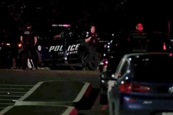 This image made from a video provided by KOMO shows police working at the scene of a shooting at Harry Todd Park in Lakewood, Wash., Wednesday, May 28, 2025. (KOMONEWS.COM via AP)