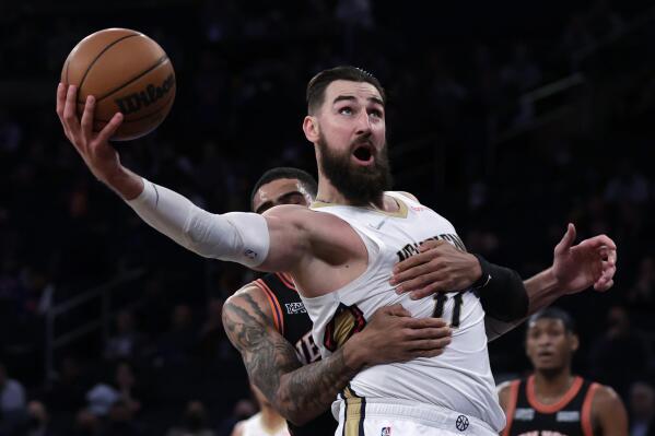 New Orleans Pelicans center Jonas Valanciunas is fouled by New York Knicks forward Obi Toppin during the second half of an NBA basketball game Thursday, Jan. 20, 2022, in New York. The Pelicans won 102-91. (AP Photo/Adam Hunger)