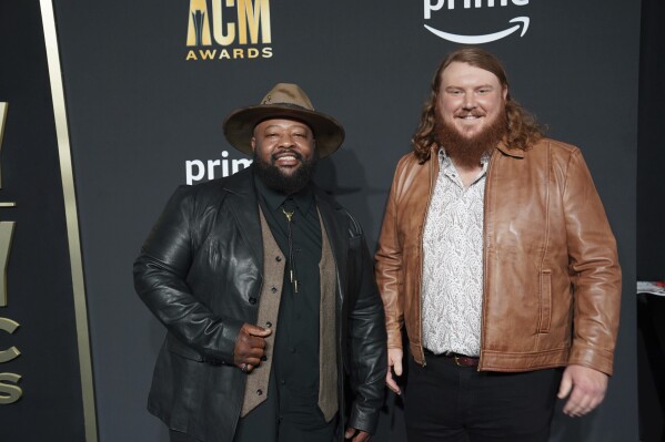 FILE - Leo Brooks, left, and Andrew Millsaps of Neon Union arrive at the 58th annual Academy of Country Music Awards, May 11, 2023, at the Ford Center in Frisco, Texas. Neon Union will be performing at the Country Bay Music Festival, which is scheduled for Saturday, Nov. 11, and Sunday, Nov. 12, at the historic Miami Marine Stadium, just southeast of downtown on Virginia Key in Biscayne Bay, Fla. (AP Photo/Jeffrey McWhorter, File)