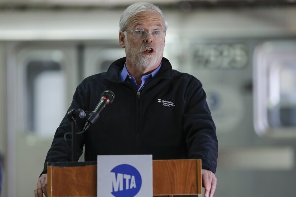 FILE - In this Tuesday, May 19, 2020, file photo, Metropolitan Transportation Authority chairman and CEO Patrick Foye speaks during a news conference on new measures involving UV-C light technology to disinfect trains and buses during the coronavirus pandemic, in New York. New York's mass transit agency wants Apple to come up with a better way for iPhone users to unlock their phones without taking off their masks, as it seeks to guard against the spread of COVID-19 in buses and subways. (AP Photo/Frank Franklin II, File)