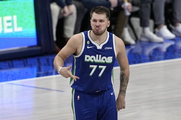 Dallas Mavericks guard Luka Doncic celebrates after sinking a three-point shot in the second half of an NBA basketball game against the Golden State Warriors in Dallas, Tuesday, Nov. 29, 2022. (AP Photo/Tony Gutierrez)