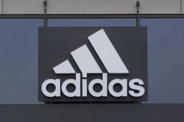 A sign is displayed in front of an Adidas retail store in Paramus, N.J., Tuesday, Oct. 25, 2022. Adidas has ended its partnership with the rapper formerly known as Kanye West over his offensive and antisemitic remarks, the latest company to cut ties with Ye and a decision that the German sportswear company said would hit its bottom line. (AP Photo/Seth Wenig)