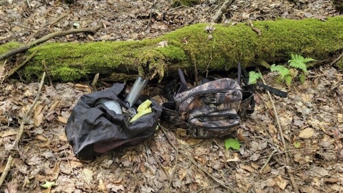 In this image provided by the Pennsylvania State Police, two bags of supplies, authorities believe belong to an escaped inmate, were found by law enforcement while searching in the woods in northwestern Pennsylvania. The date and location were not disclosed due to the ongoing investigation. Michael Burham, 34, fled the Warren County Prison late Thursday, July 5, 2023. by climbing on exercise equipment to gain access to the roof and then used a rope fashioned from jail bedding to get down, authorities said. Prior to his escape, Burham had been held on $1 million bail and was facing numerous charges, including kidnapping and burglary. (Pennsylvania State Police via AP)