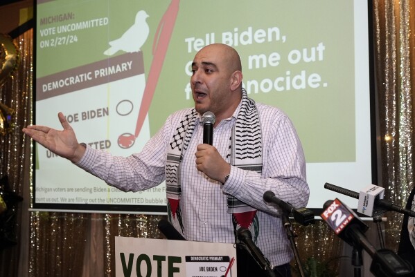 Abbas Alawich speaks during an election night gathering, Tuesday, Feb. 27, 2024, in Dearborn, Mich. Some Democratic voters pledged to vote "uncommitted" in Tuesday's primary to let President Joe Biden know they aren't happy with his support for Israel in its response to the Oct. 7 attacks by Hamas. (AP Photo/Carlos Osorio)