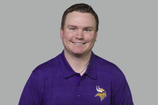 THIS SUBSTITUTES FOR NY156 - FILE - This is a 2014 photo of Adam Zimmer of the Minnesota Vikings NFL football team. Former Minnesota co-defensive coordinator Adam Zimmer, an NFL assistant for 17 years and the son of previous Vikings head coach Mike Zimmer, has died. He was 38. Corri Zimmer White, his younger sister, confirmed the death on her Instagram account on Tuesday. Adam Zimmer died on Monday, Oct. 31, 2022, she said. (AP Photo/File)