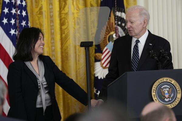 President Joe Biden talks about his nomination of Julie Su, left, to serve as the Secretary of Labor during an event in the East Room of the White House in Washington, Wednesday, March 1, 2023. (AP Photo/Susan Walsh)