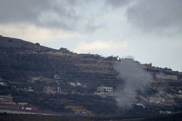 An explosion in a Lebanese village can be seen from across the border in north Israel, Wednesday, Nov. 20, 2024. (AP Photo/Ohad Zwigenberg)