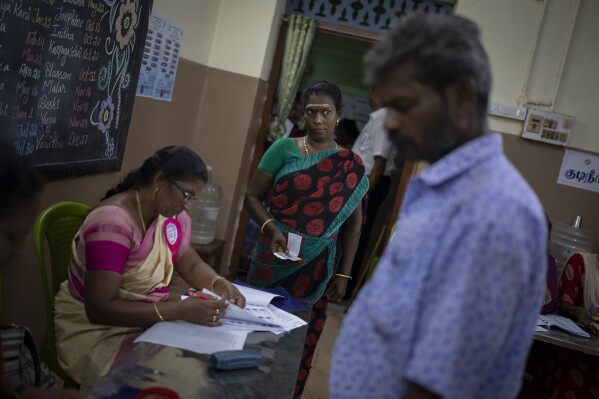 People arrive to vote during the first round of voting of India’s national election in Chennai, southern Tamil Nadu state, Friday, April 19, 2024. Nearly 970 million voters will elect 543 members for the lower house of Parliament for five years, during staggered elections that will run until June 1. (AP Photo/Altaf Qadri)
