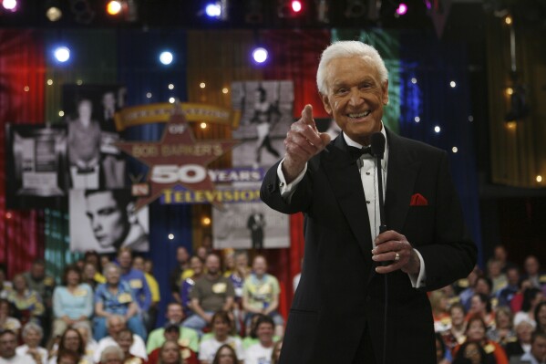 FILE - Legendary game show host Bob Barker reacts during filming of a special prime-time episode of 