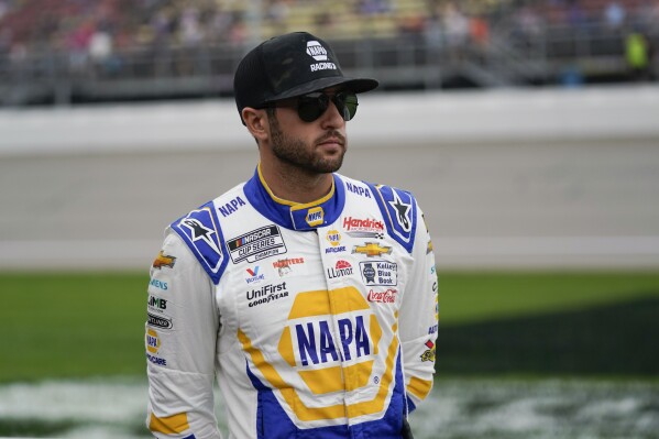 Chase Elliott looks on before a NASCAR Cup Series auto race at Michigan International Speedway in Brooklyn, Mich., Sunday, Aug. 6, 2023. (AP Photo/Paul Sancya)