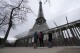 Visitors stand at the closed gates leading to the Eiffel Tower, Tuesday, Feb. 20, 2024 in Paris. Visitors to the Eiffel Tower were turned away for the second consecutive day because of a strike over poor financial management at one of the world's most-visited sites. (APPhoto/Michel Euler)