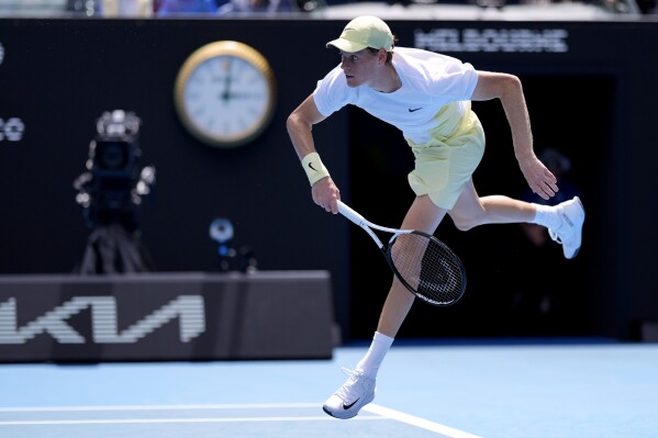 Jannik Sinner of Italy serves to Nicolas Jarry of Chile during their first round match at the Australian Open tennis championship in Melbourne, Australia, Monday, Jan. 13, 2025. (AP Photo/Asanka Brendon Ratnayake)