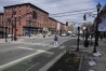 Pedestrians cross the street at the intersection of Washington and 5th in Hoboken, N.J., Thursday, Feb. 22, 2024. This intersection has a planter which doubles as a curb extender, bottom center, preventing parking near the intersection and increasing visibility for pedestrians. (APPhoto/Seth Wenig)