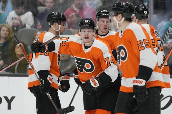 Philadelphia Flyers right wing Owen Tippett (74) celebrates with teammates after scoring against the San Jose Sharks during the third period of an NHL hockey game in San Jose, Calif., Thursday, Dec. 29, 2022. (AP Photo/Jeff Chiu)