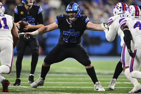 Detroit Lions center Frank Ragnow looks to block during the second half of an NFL football game against the Buffalo Bills in Detroit, Dec. 15, 2024. (AP Photo/David Dermer, file)