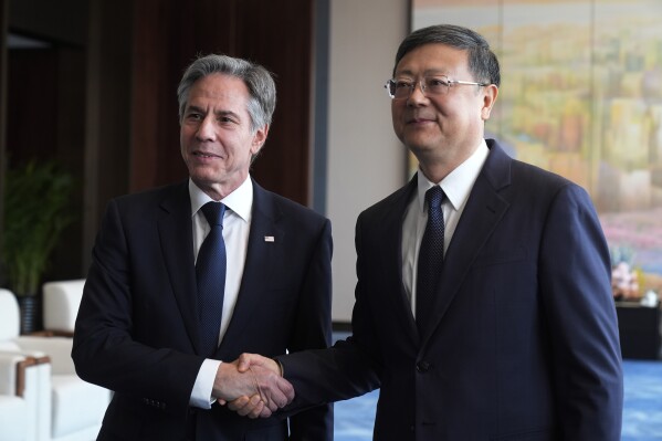 U.S. Secretary of State Antony Blinken, left, meets with Shanghai Party Secretary Chen Jining at the Grand Halls, Thursday, April 25, 2024, in Shanghai, China. (AP Photo/Mark Schiefelbein, Pool)