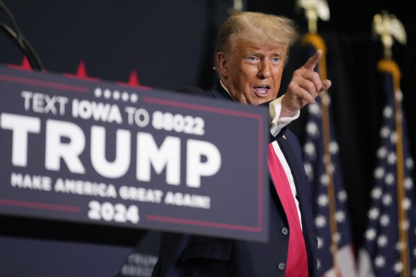 FILE - Former President Donald Trump points to the crowd as he leaves the stage after speaking at a campaign rally Monday, Oct. 16, 2023, in Clive, Iowa. Donald Trump will headline his eighth campaign event in Iowa in a little more than a month on Sunday as part of the former president's accelerated fall schedule leading up to the first-in-the-nation caucuses in January. (AP Photo/Matthew Putney, File)
