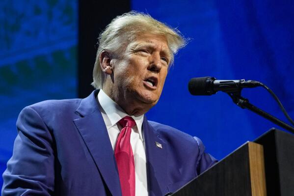 FILE - Former President Donald Trump speaks at the National Rifle Association Convention in Indianapolis, Friday, April 14, 2023. Trump has raised more than $34 million for his 2024 campaign since the start of the year, according to his campaign. (AP Photo/Michael Conroy, File)
