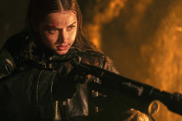 This image released by Lionsgate shows Ana de Armas in a scene from "Ballerina." (Lionsgate via AP)